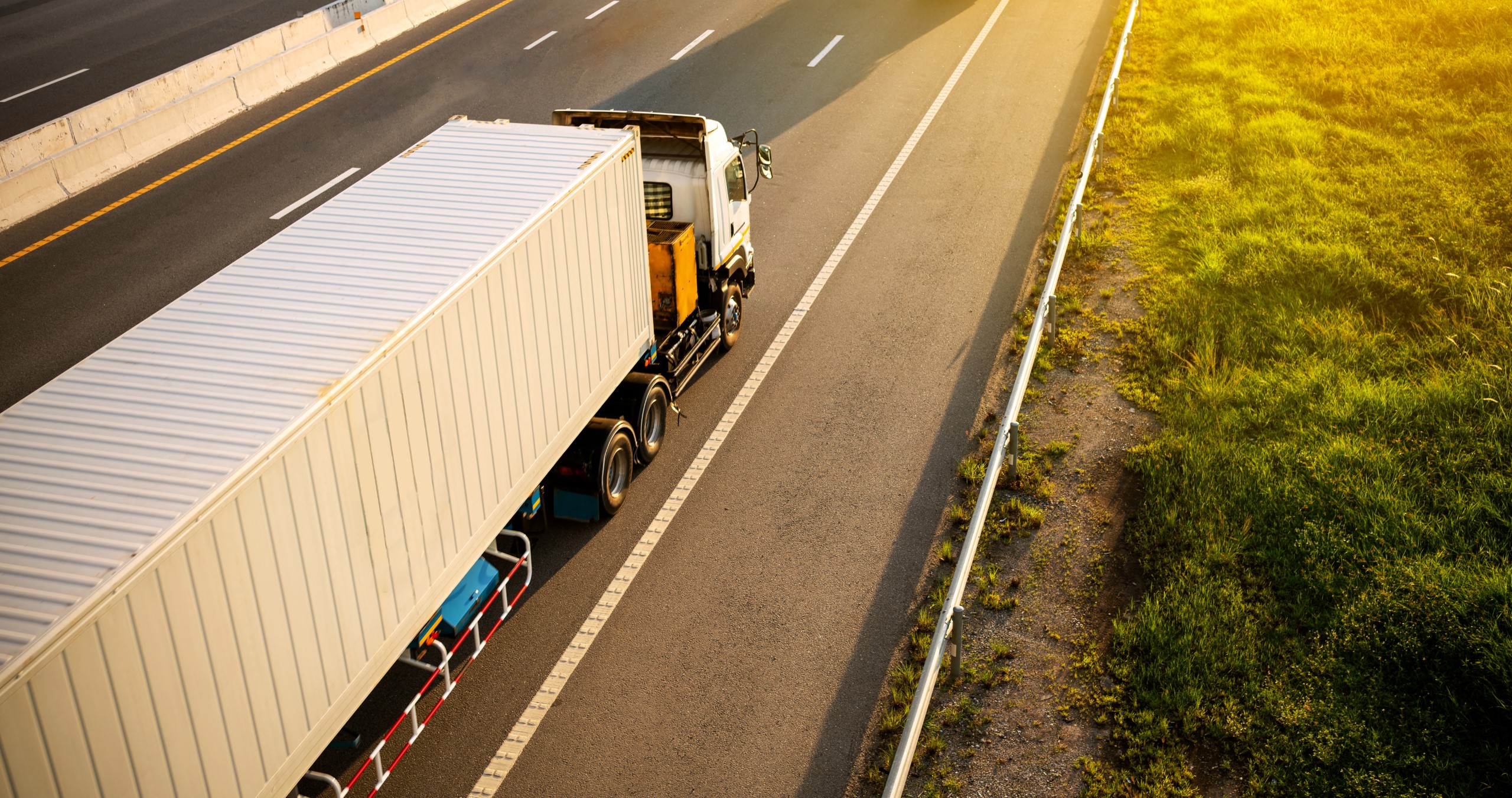 White Truck on highway road with container, transportation concept.,import,export logistic industrial Transporting Land transport on the expressway.motion blurred to soft focus